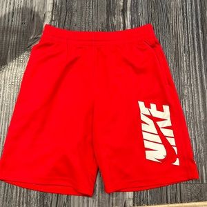 Red and white Nike shorts.
